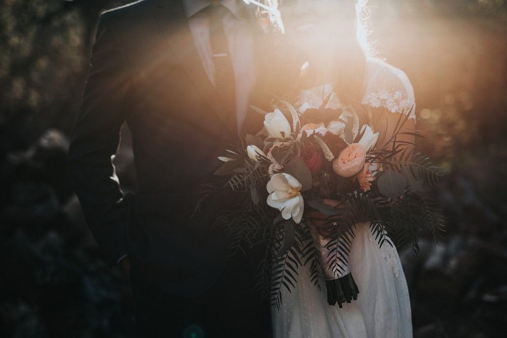 An intimate outdoor wedding celebration filled with light and flowers